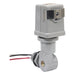 Intermatic K4221C 120V photocontrol side view showing adjustable swivel mount and lead wires.