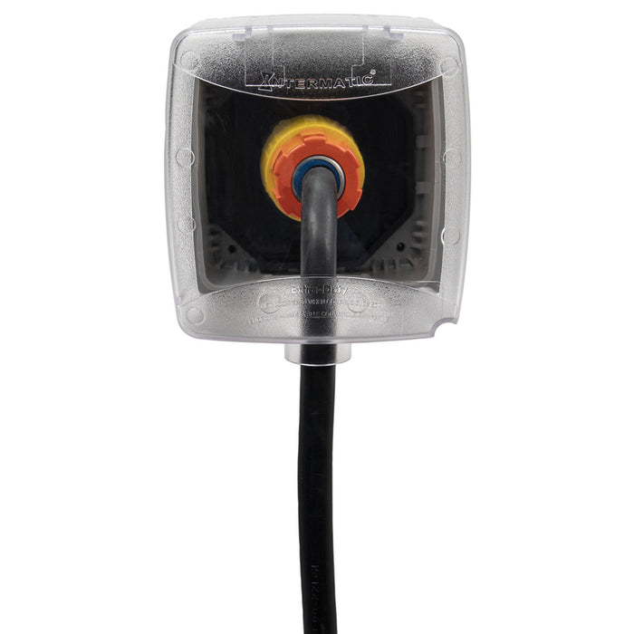 Intermatic WP5500C double-gang weatherproof cover with electrical cord connected, front view.